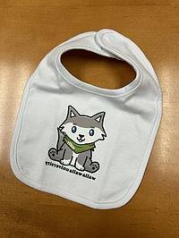 A white baby bib with a cartoon illustration of WWU mascot Wally Wolf. 